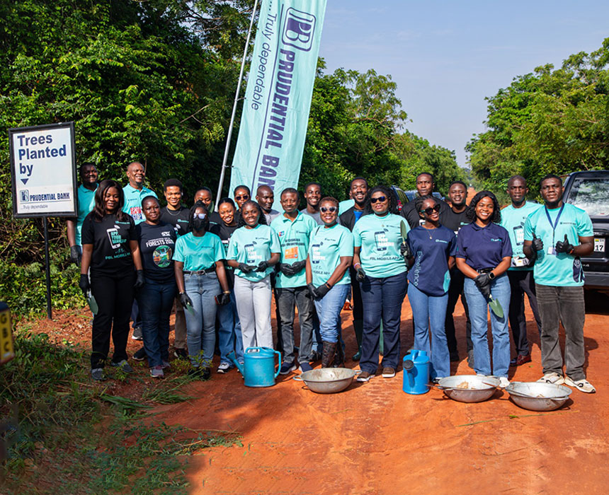 Staff of Prudential Bank about to restore the trees.